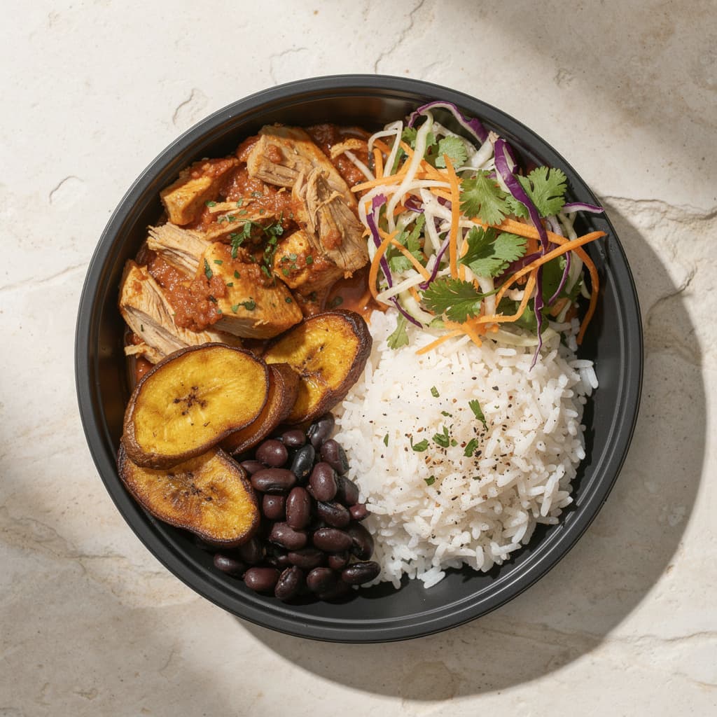 A fresh Modo bowl of chicken, rice, beans, and plantain